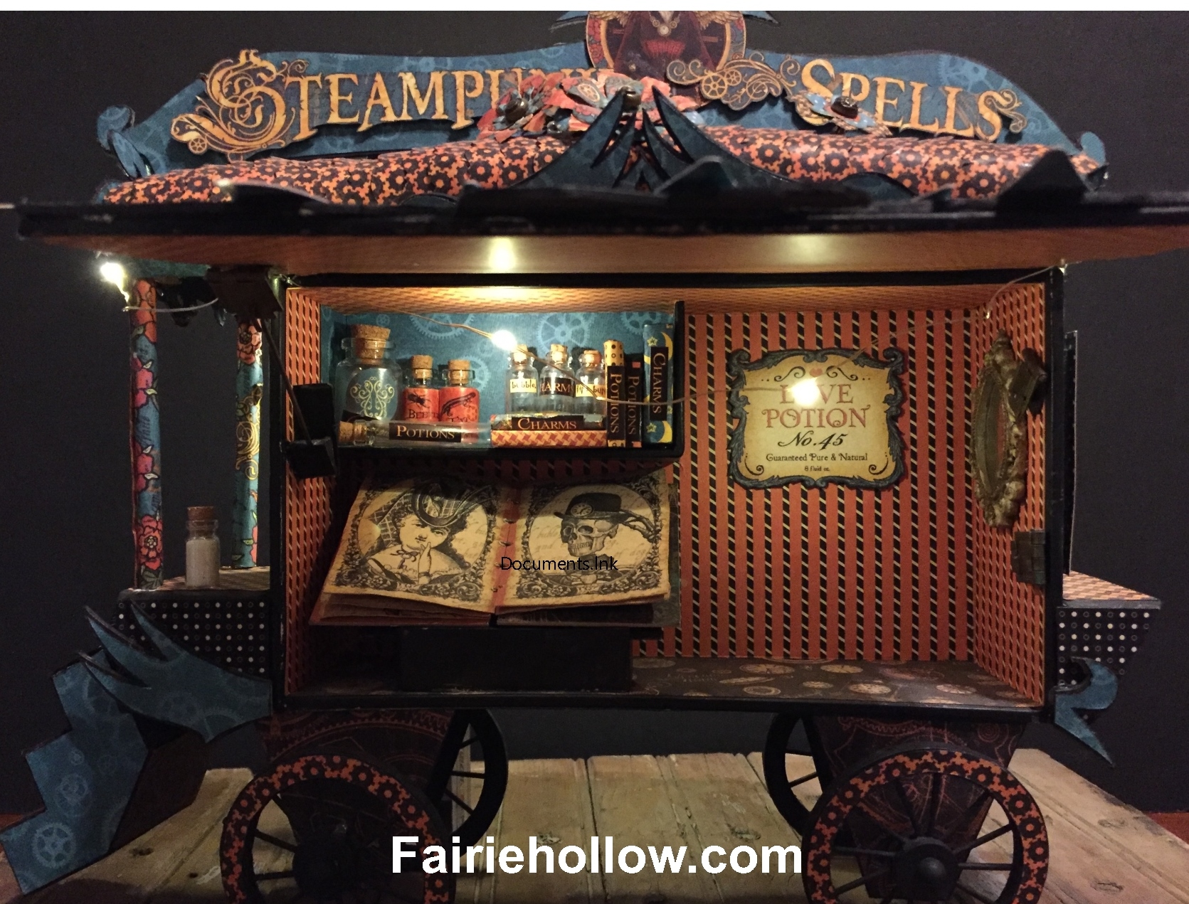 This fairies steampunk caravan is made from a cigar box and covered with papers from Graphic 45. fairiehollow.com