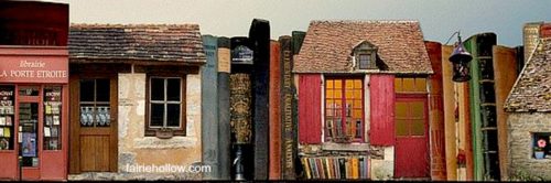 A village of books that seem like bookstores.Fairy houses made from books can make a bookcase or library a magical fairy corner|fairiehollow.com 