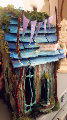 5 Magical Forest Fairy Houses Blue fairy house blue sticks windows pink banner inspire make | fairehollow.com 