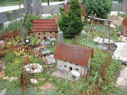 rusted metal roofs stone fairy houses | fairiehollow.com