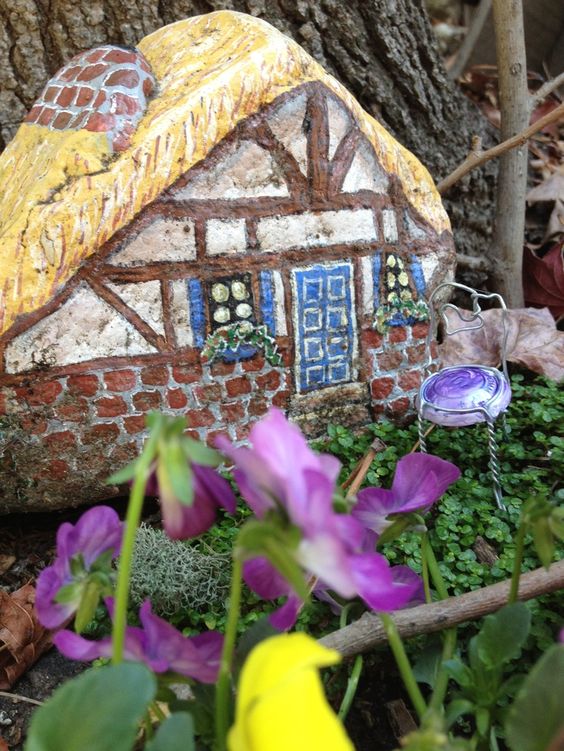 painted fairy house on rock | fairiehollow.com